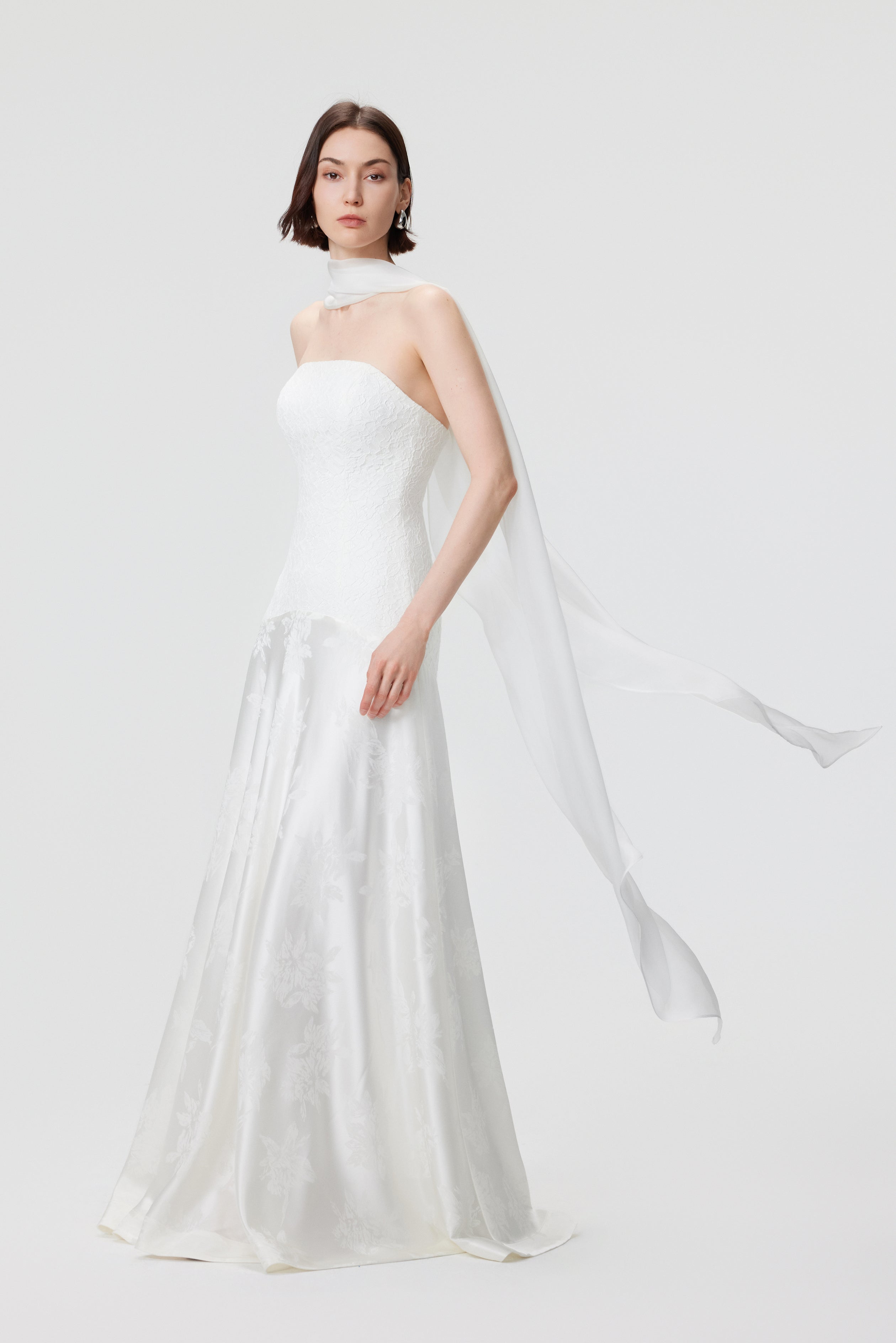 The Vera Gown styled with a multi-way scarf, showcasing a modular bridal look for civil ceremonies and rehearsal dinners.