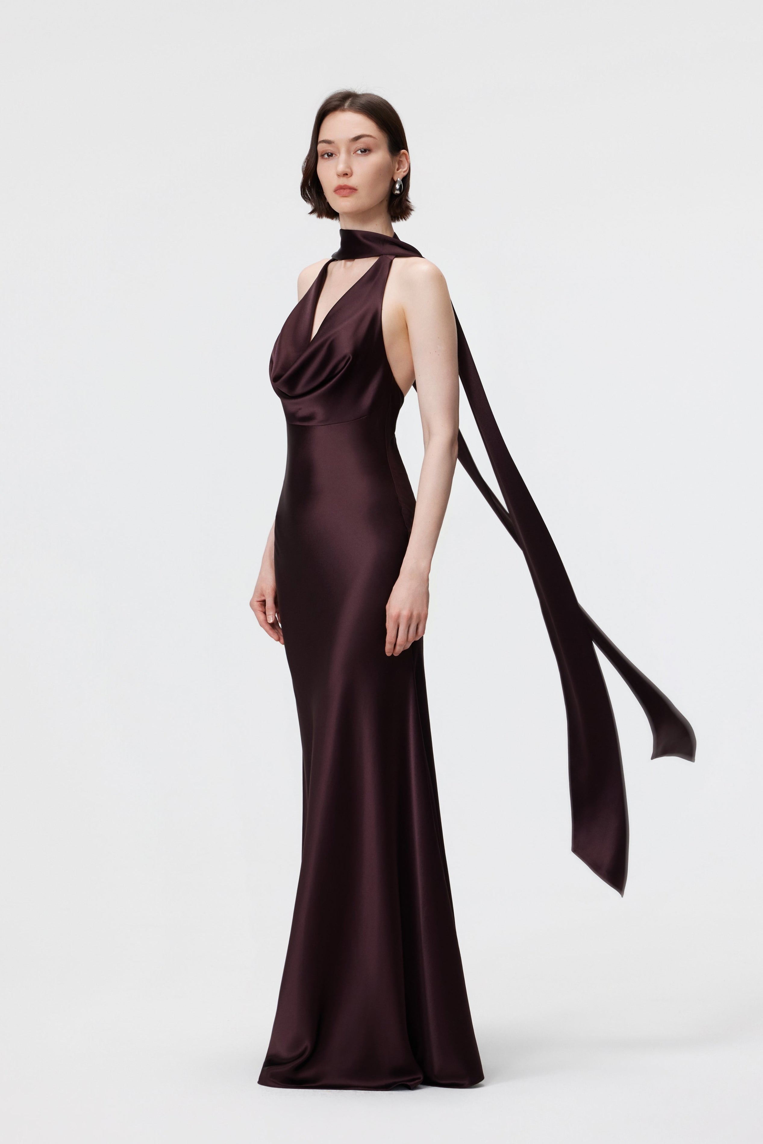 AENSO Rhea Halter Gown and scarf set in Espresso; showcasing the fluid, bias-cut drape and coordinated tonal styling.