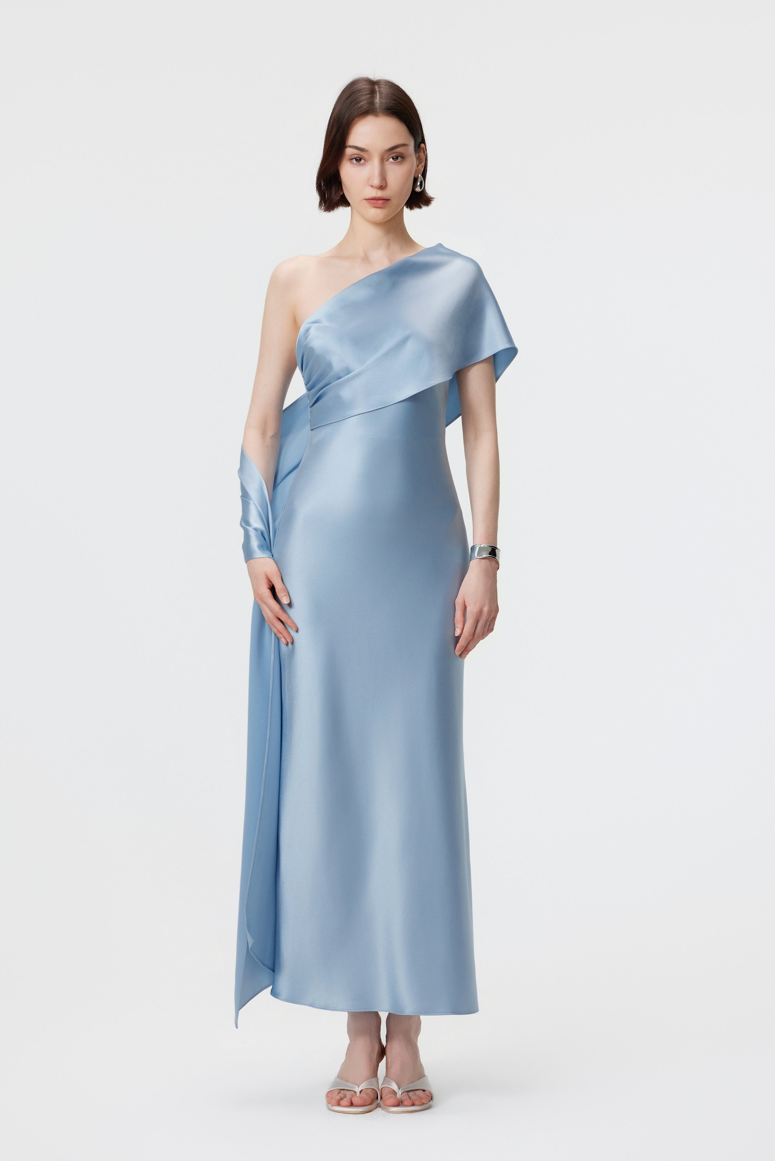 AENSO Lyra dress in Glacial Mist; front view featuring the hand-held scarf style for a rhythmic, winged effect.