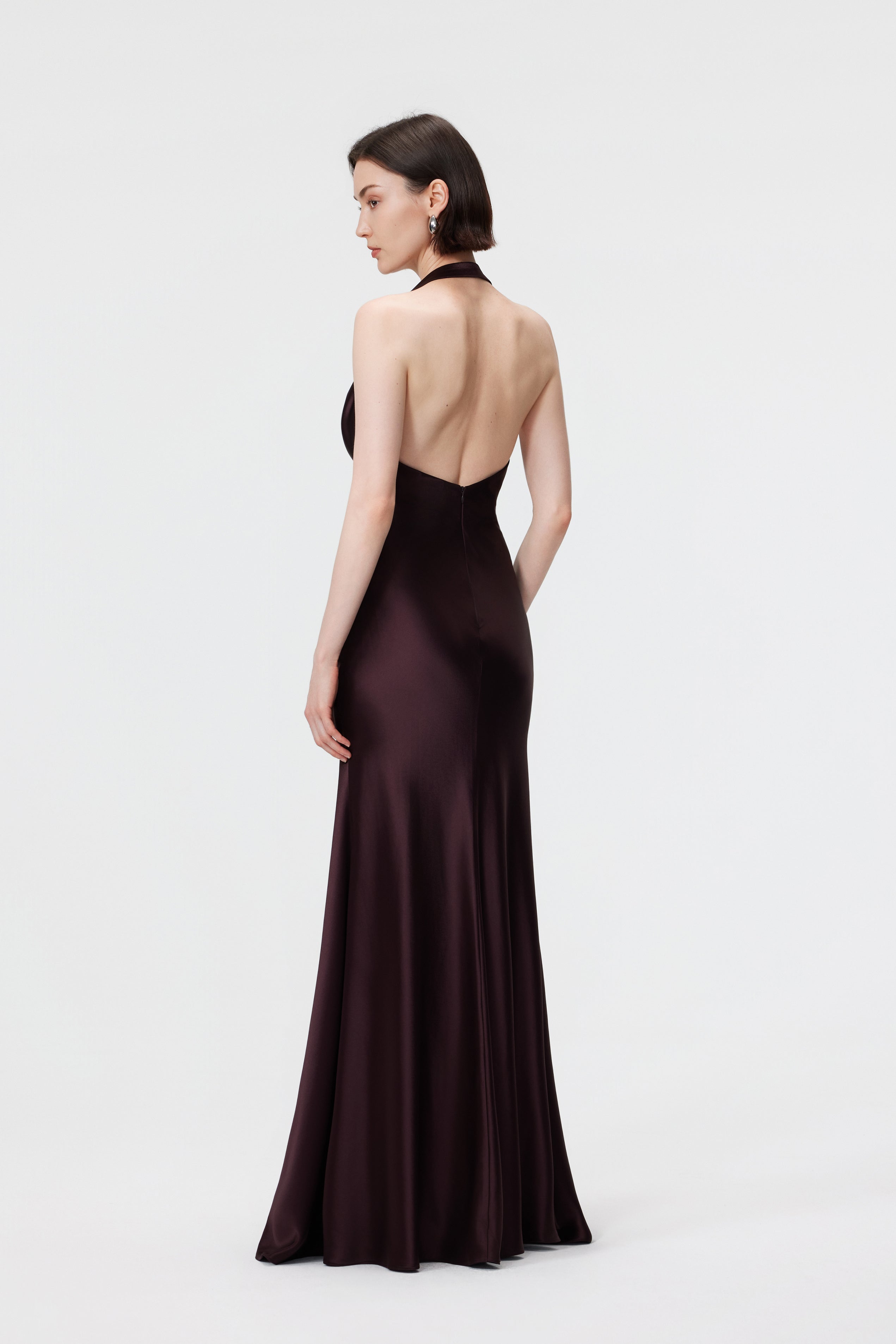 Detailed rear view of the AENSO Rhea Gown in Espresso, highlighting the refined open-back and minimalist halter fastening.