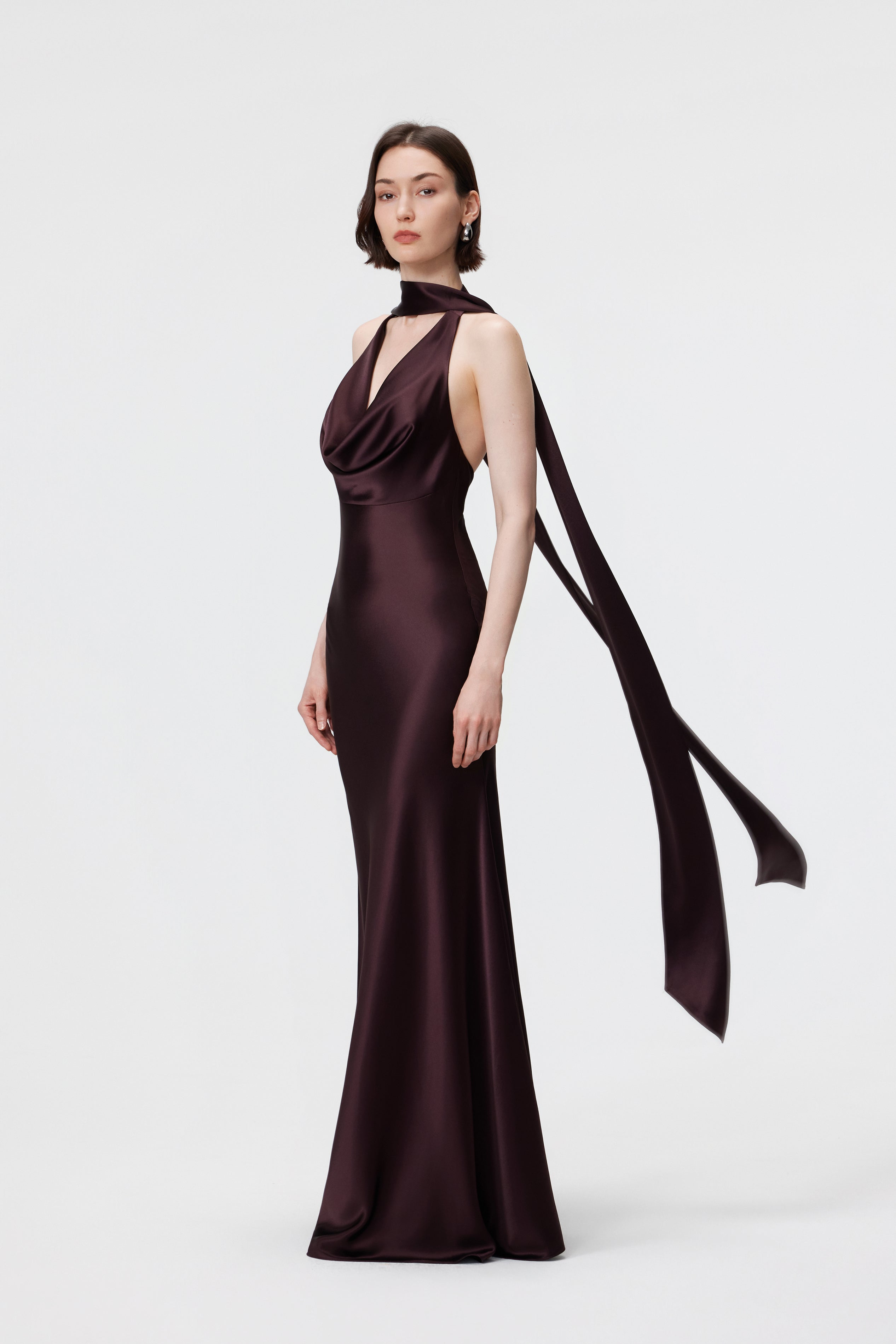 AENSO Rhea Halter Gown and scarf set in Espresso; showcasing the fluid, bias-cut drape and coordinated tonal styling.