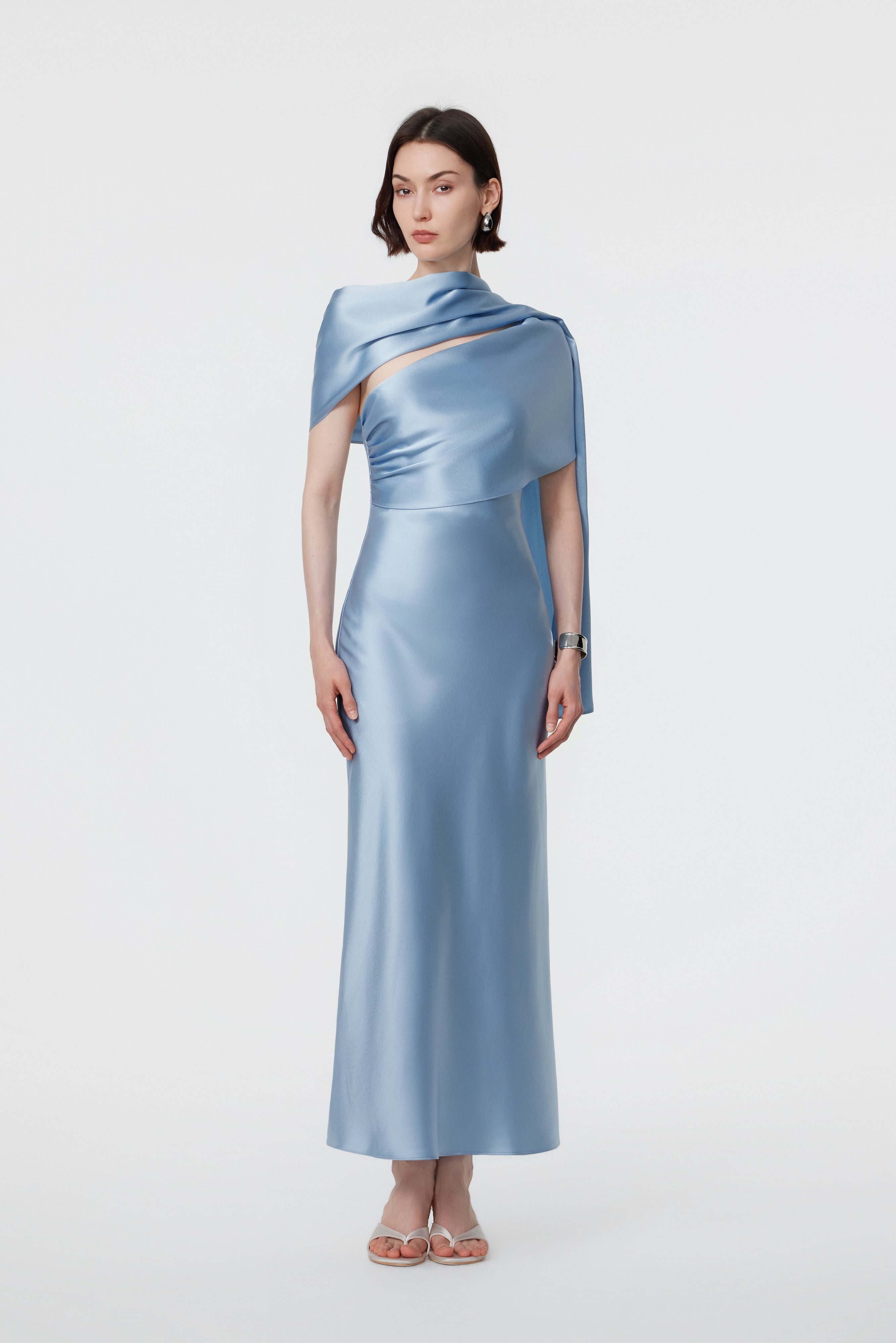 AENSO Lyra dress in Glacial Mist; featuring The Sleeve styling with soft, architectural shoulder coverage and a clean, draped neckline in luminous satin.