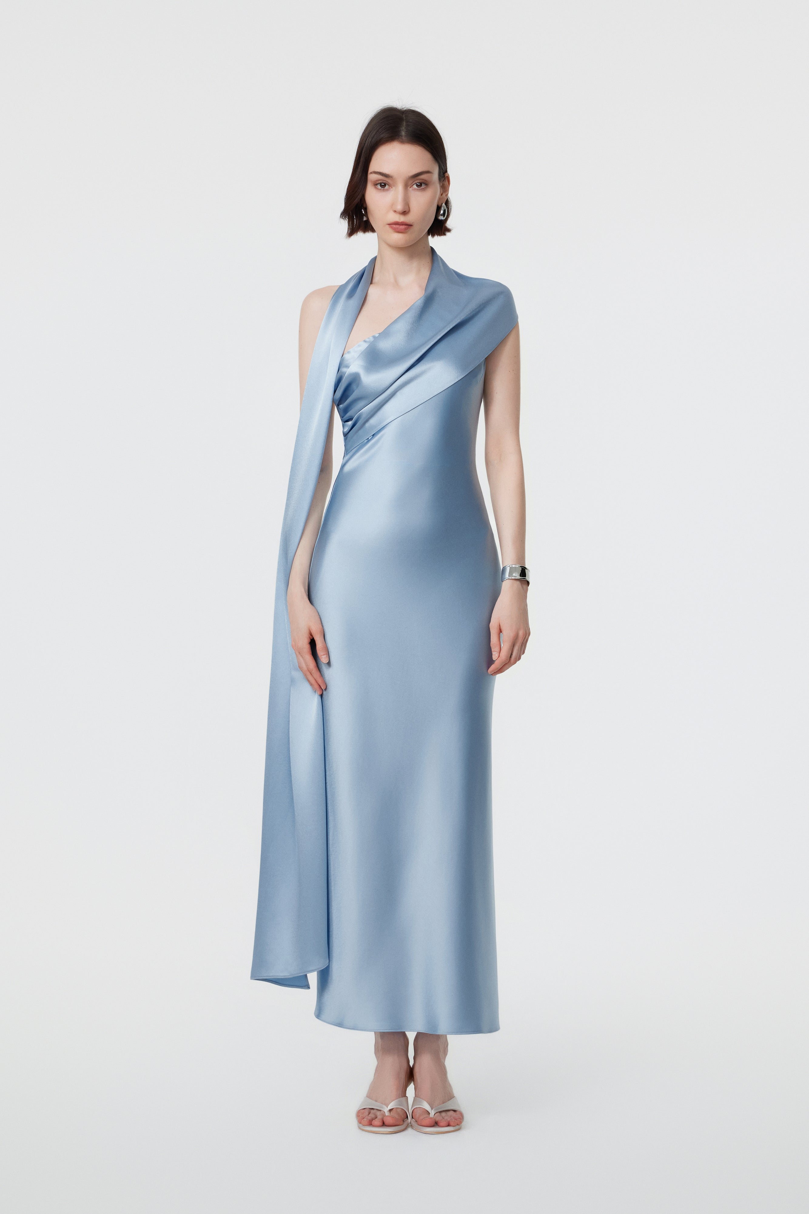 AENSO Lyra dress in Glacial Mist; featuring The Side-Draped Cascade styling with a linear, statuesque fall that trails from the shoulder for an elongated silhouette.